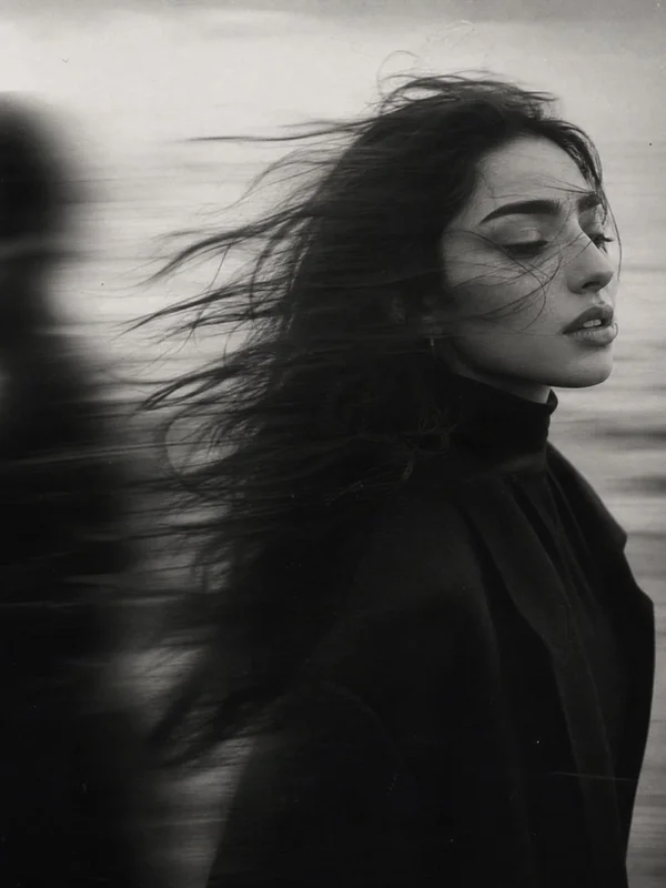 Illustrative adult portrait: Black and white portrait with windblown hair